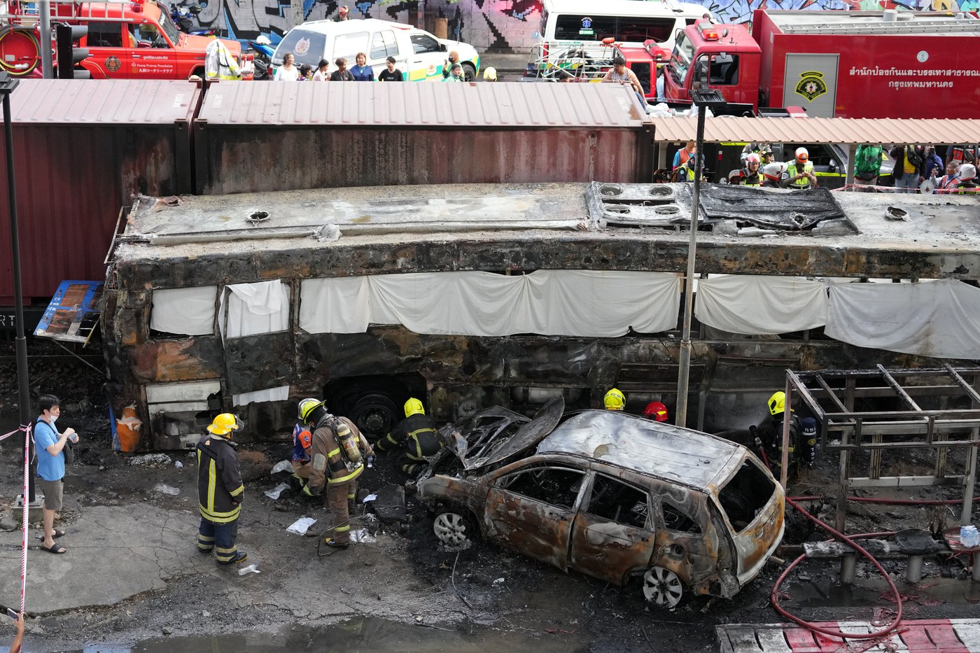 A cargo train hits a public bus at a Bangkok rail crossing, killing at least 8 | iNwheels