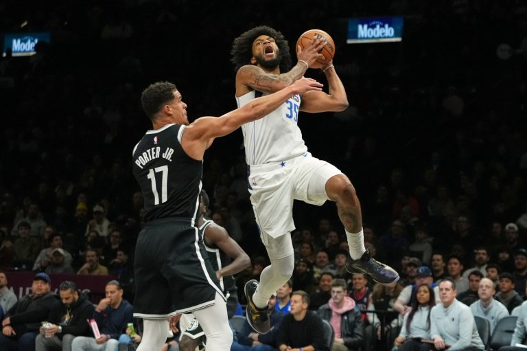 Mavericks beat the Nets 123-114 after both teams arrive on game day because of the blizzard | iNFOnews.ca