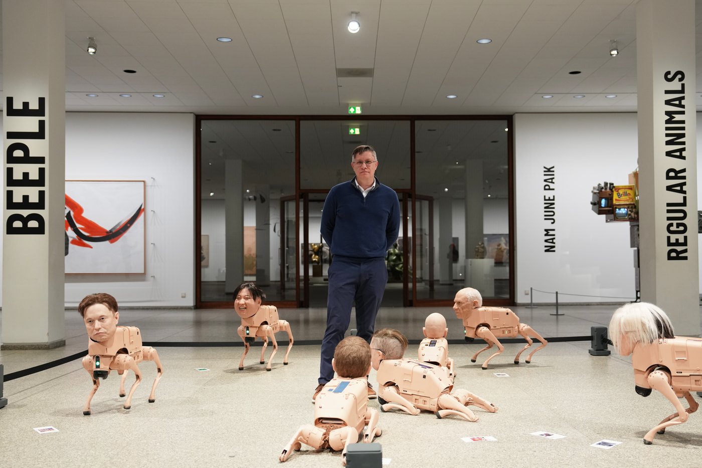 Robot dogs with Musk and Zuckerberg heads roam around Berlin museum in Beeple's new exhibit | iNFOnews.ca