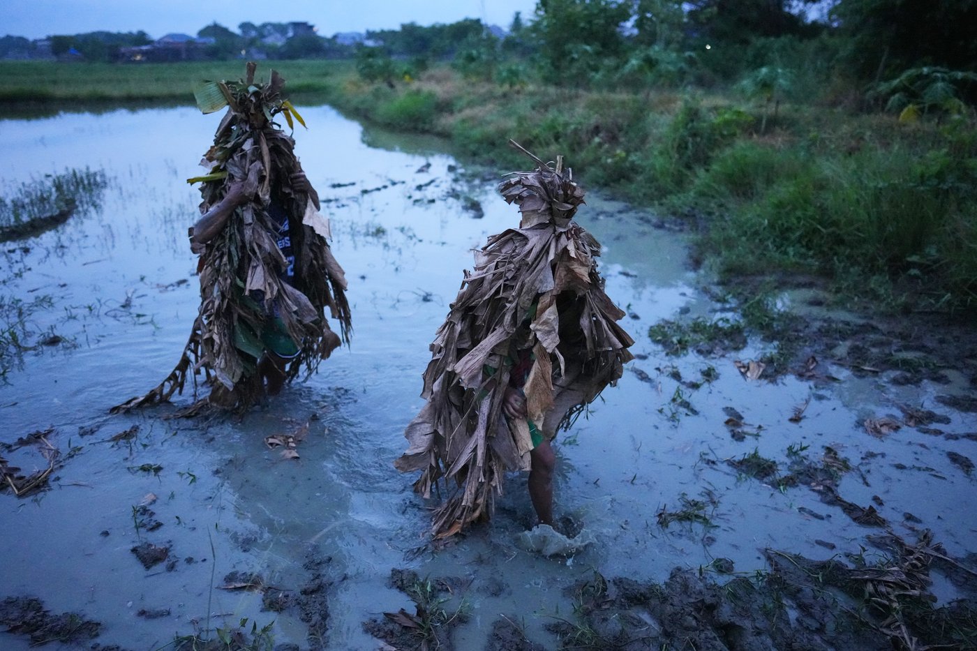 Photos show Philippine Catholics smearing mud on their bodies for festival honoring John the Baptist | iNFOnews.ca