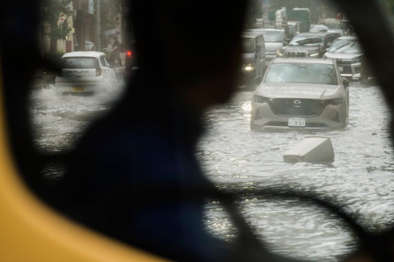 Sudden deluge of rain floods some streets and halts air and rail traffic in Tokyo | iNFOnews.ca