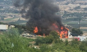 Black smoke and flames engulf a Vernon home.