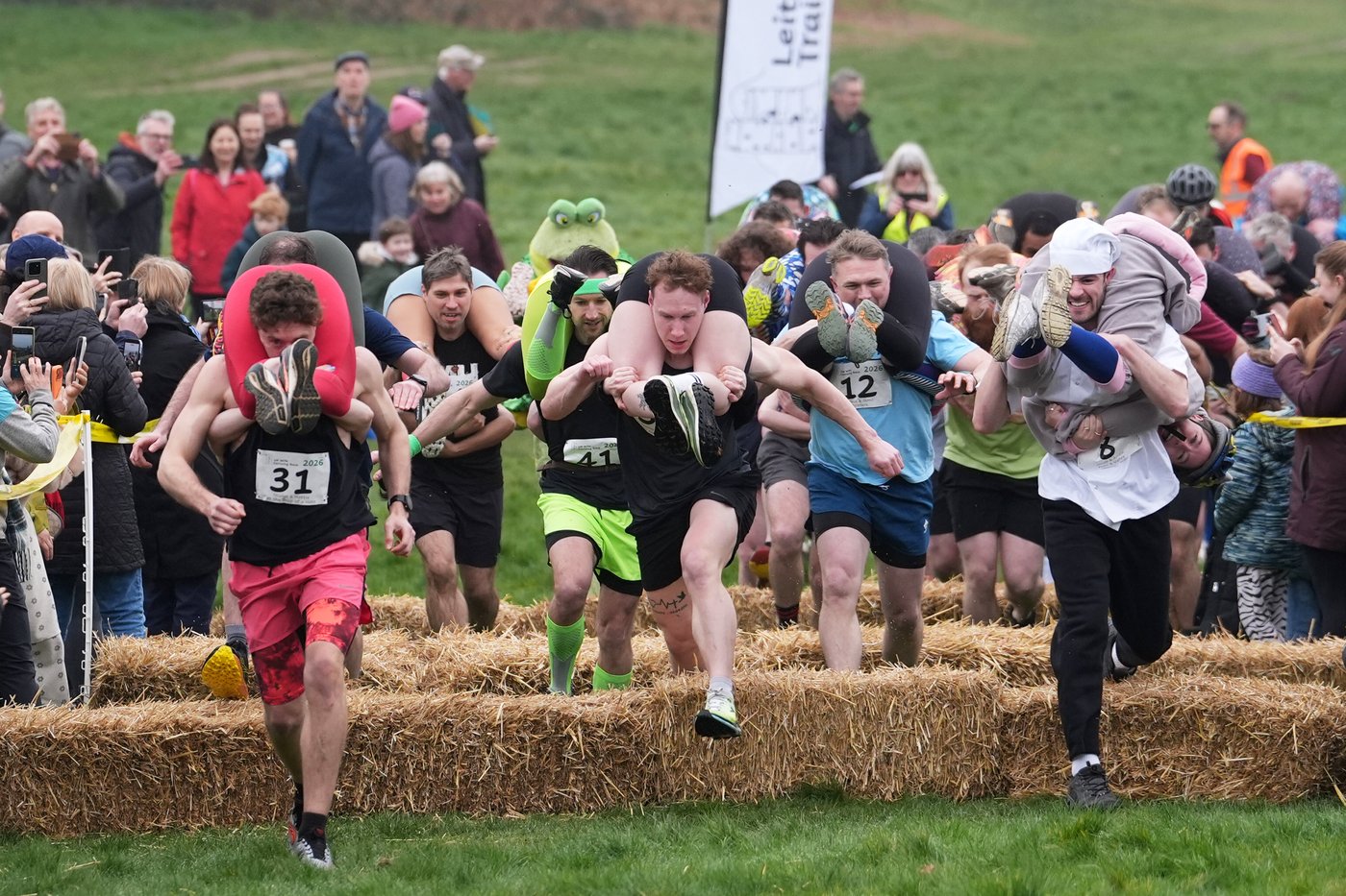 Finnish pair wins a barrel of ale in annual 'wife-carrying' contest in England | iNFOnews.ca
