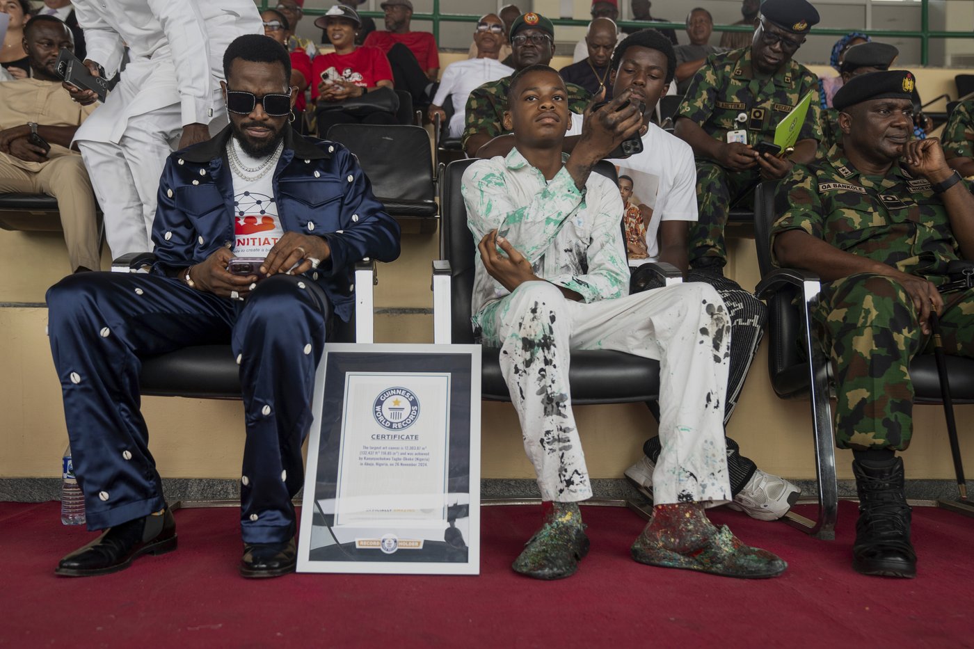 Nigerian teenager sets world painting record with canvas that's bigger than a soccer field | iNFOnews.ca Nigerian teenager sets world painting record with canvas that's bigger than a soccer field | iNFOnews.ca