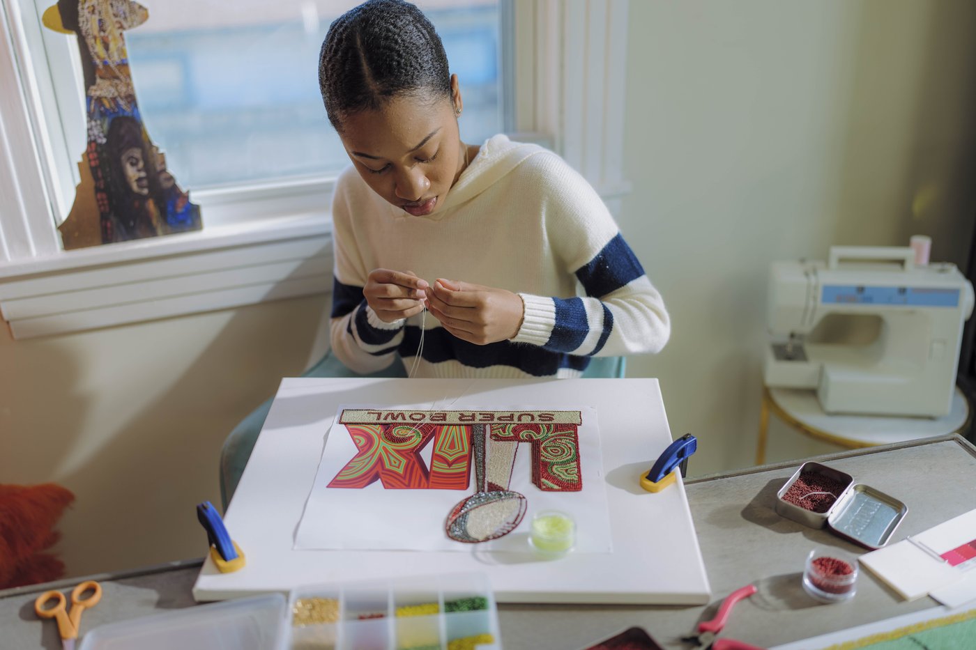 Super Bowl artist weaves Black Masking culture into vibrant logo and theme art for NFL global stage | iNFOnews.ca Super Bowl artist weaves Black Masking culture into vibrant logo and theme art for NFL global stage | iNFOnews.ca
