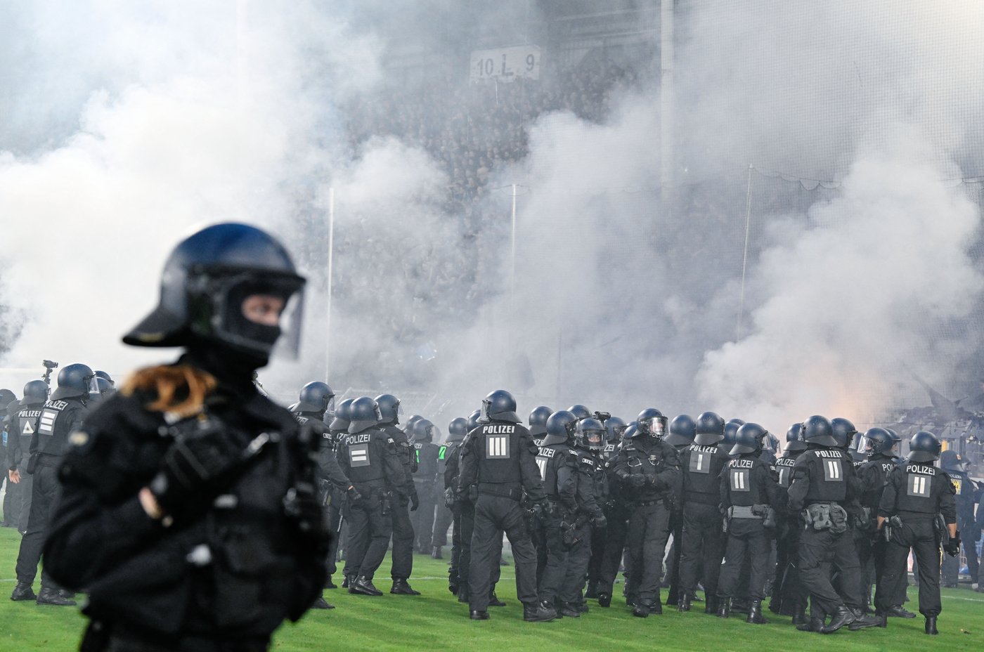 German Cup match marred by fireworks, pitch invasion | iNFOnews.ca German Cup match marred by fireworks, pitch invasion | iNFOnews.ca