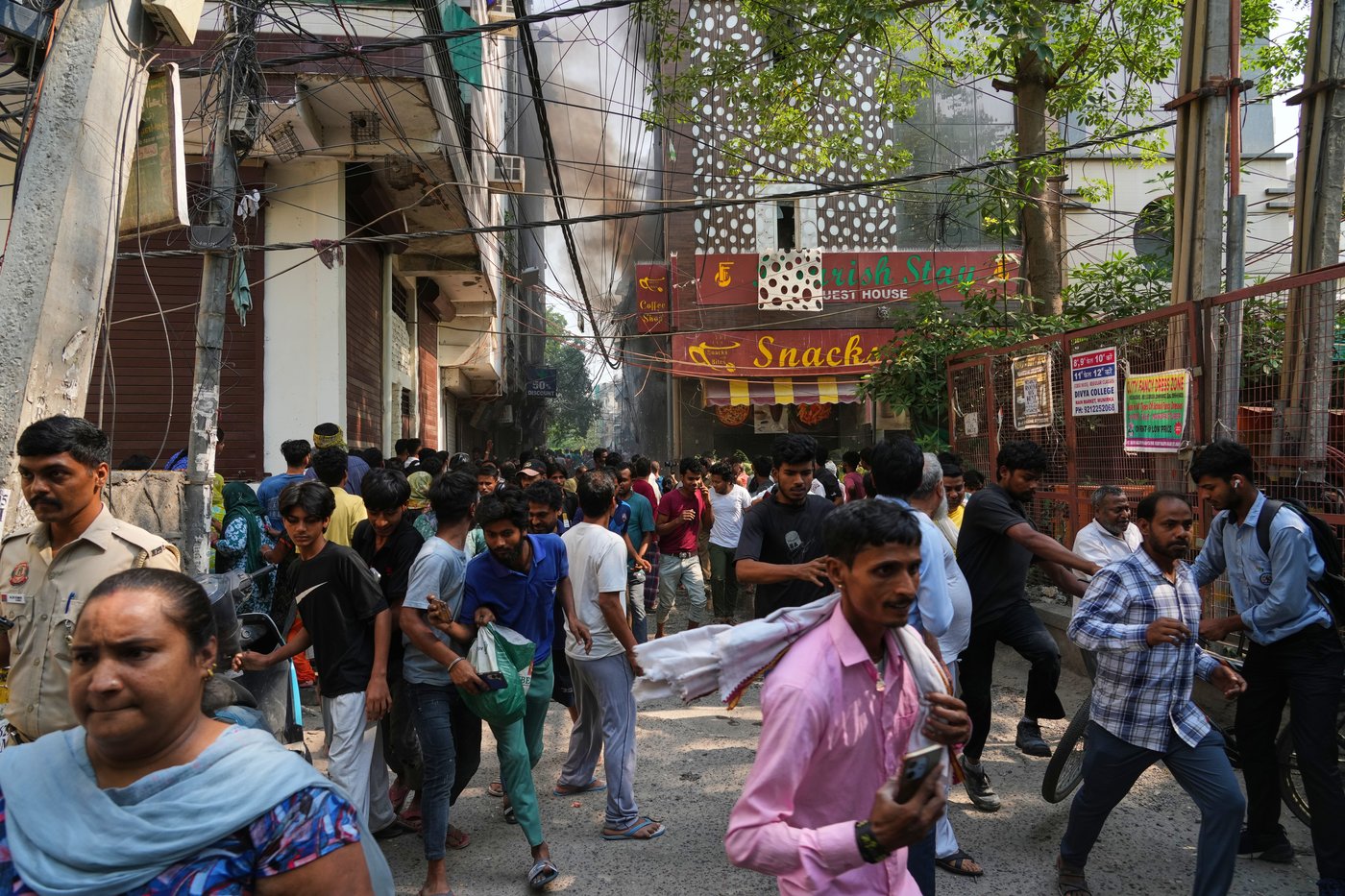 Photos show rescue efforts and aftermath of New Delhi building fire | iNFOnews.ca