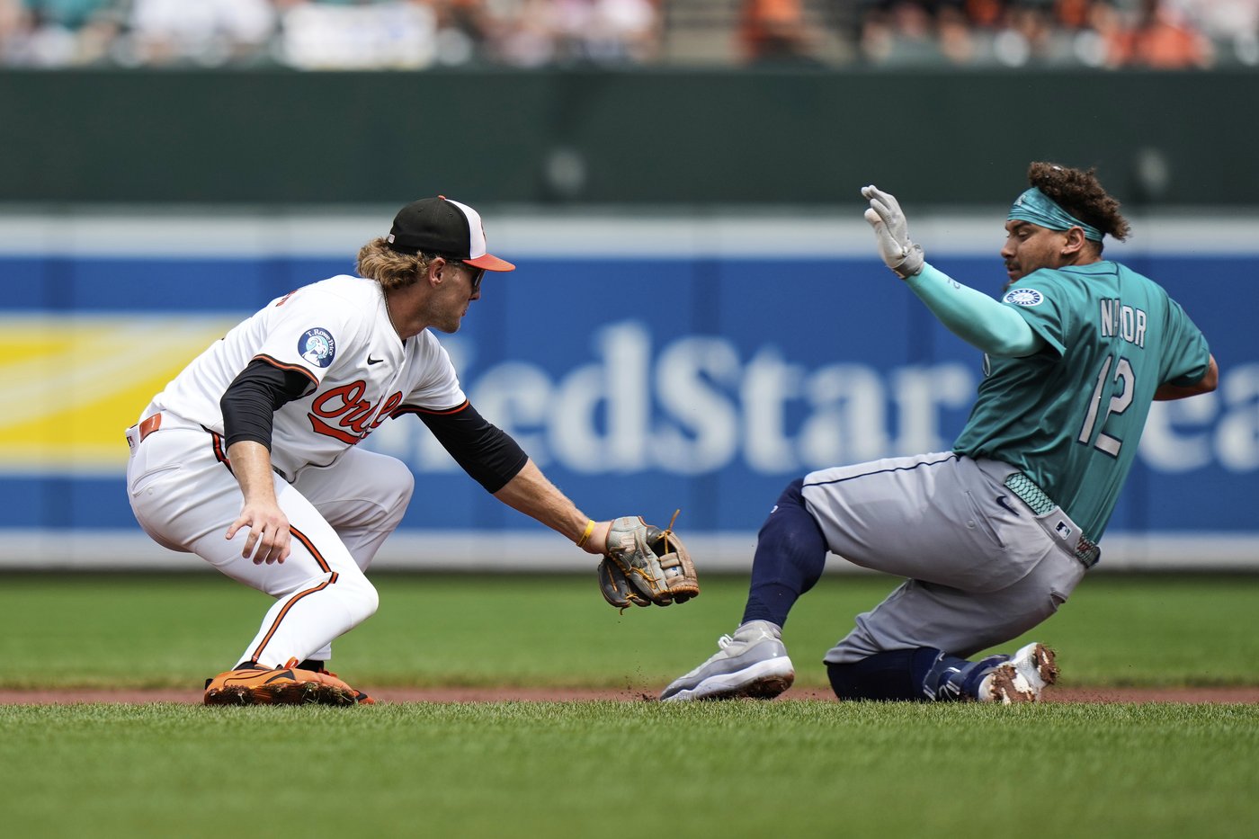 Tomoyuki Sugano earns 10th victory as Orioles outlast Mariners 5-3 after long rain delay | iNFOnews.ca