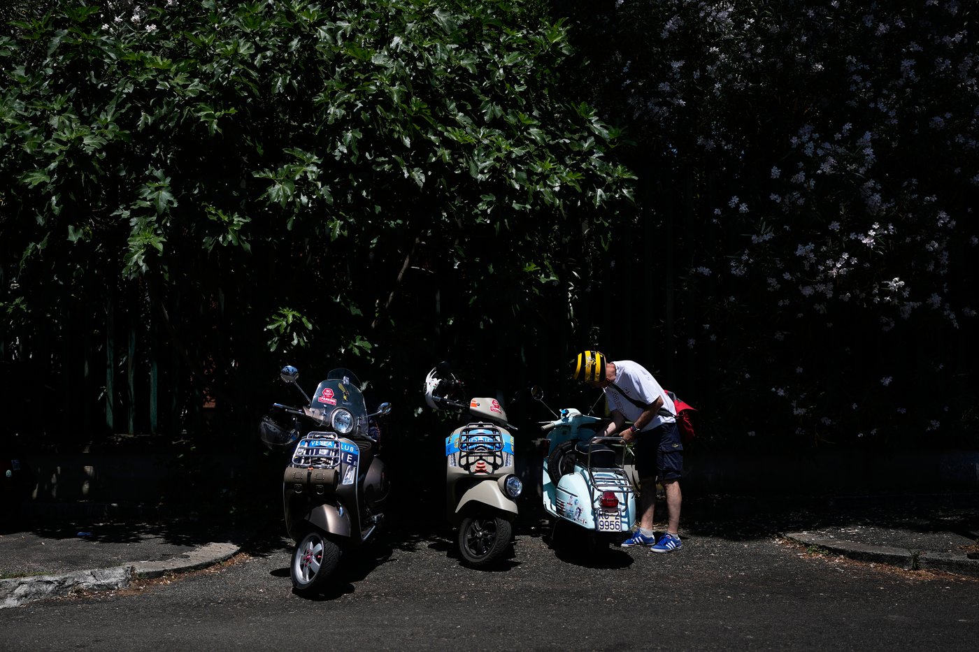 Photos show Vespa enthusiasts buzzing through Rome celebrating the little scooter's 80th anniversary | iNFOnews.ca