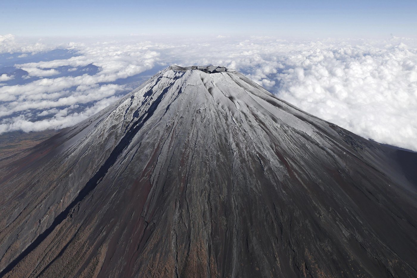 It's not official yet but Mount Fuji gets its trademark snowcap after the longest delay in 130 years | iNFOnews.ca