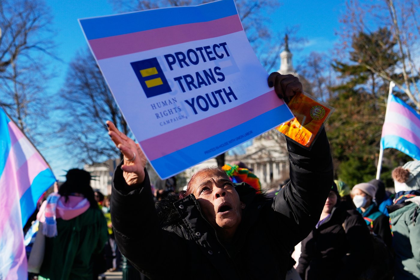 Photos of demonstrators outside the Supreme Court as it considers upholding transgender sports bans | iNFOnews.ca