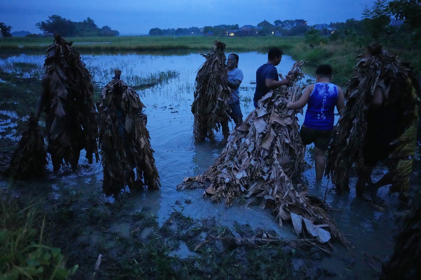 Photos show Philippine Catholics smearing mud on their bodies for festival honoring John the Baptist | iNFOnews.ca