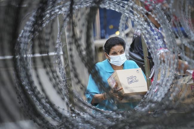 Malaysia imposes near-total lockdown after virus cases soar | iNFOnews.ca