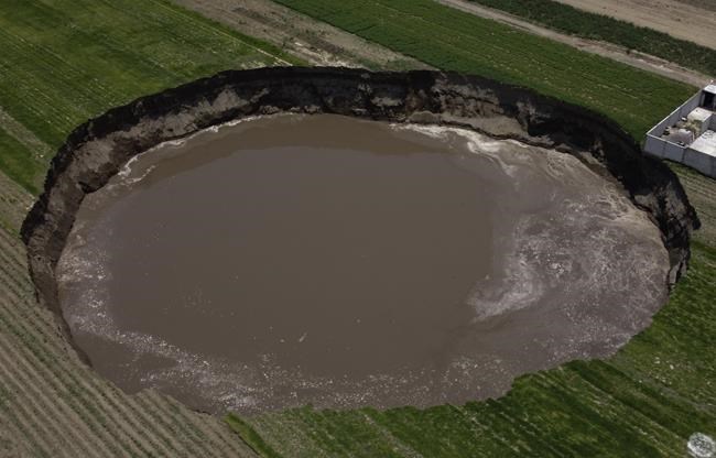 Sinkhole at Mexico farm swallows more land, traps 2 dogs | iNFOnews.ca
