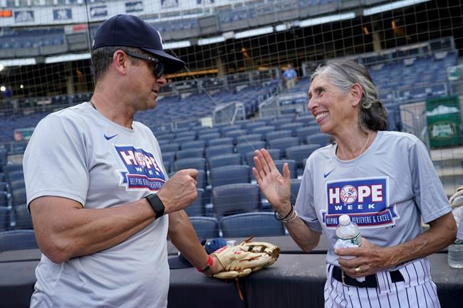 She's up! Bat girl 60 years in making reaches Yankee Stadium | iNFOnews.ca