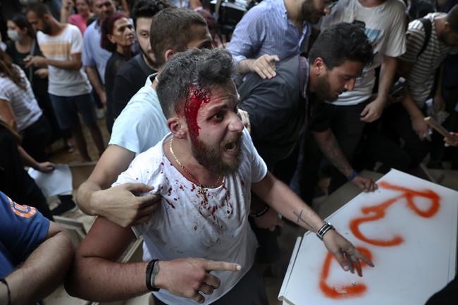 Families of Lebanese blast victims protest interior minister | iNFOnews.ca