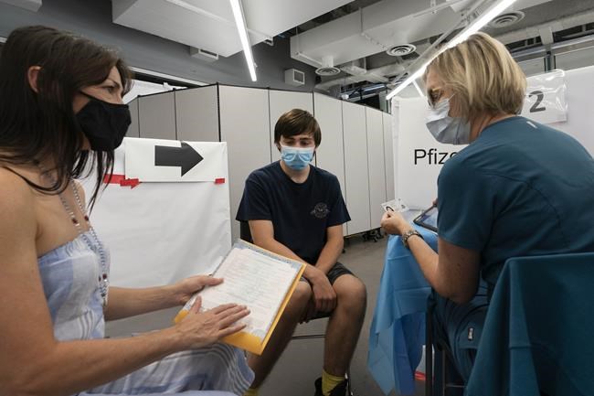 To get shots in arms, governments turn to money in pockets | iNFOnews.ca To get shots in arms, governments turn to money in pockets | iNFOnews.ca