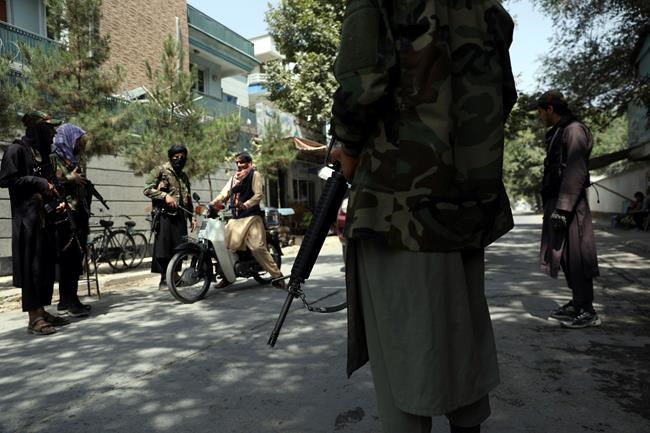 200 Afghans, including female students and dancers, make daring overland escape | iNFOnews.ca CP25330618