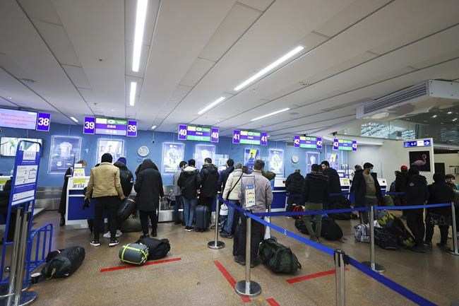 Iraqi migrants caught in border crisis in Belarus fly home | iNFOnews.ca