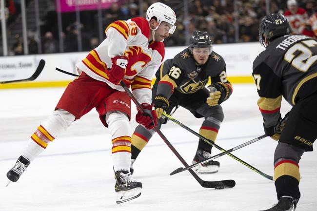 Dube, Kylington added to COVID-19 protocol, 18 Flames players now sidelined | iNFOnews.ca CP393249661
