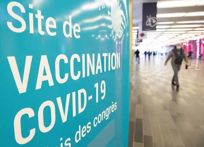 Queuing for COVID boosters and deadly ferry fire: In The News for Dec. 24 | iNFOnews.ca