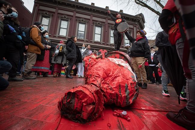 Statue of Vancouver's Gastown founder torn down during women's memorial march | iNFOnews.ca