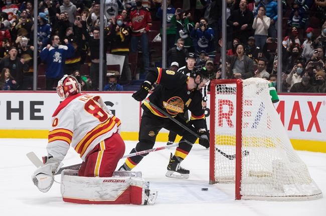 Miller puts up four points, Canucks snap Flames' 10-game win streak with lopsided win | iNFOnews.ca