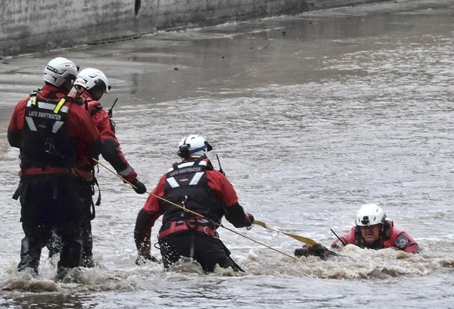 2 people, dog rescued from river as storm douses California | iNFOnews.ca