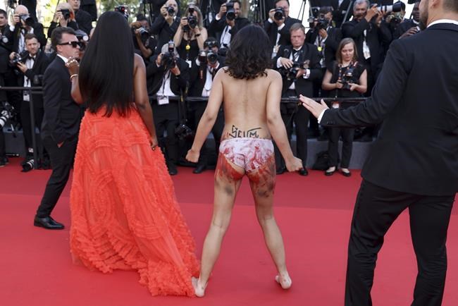 Protester crashes Cannes carpet at George Miller premiere | iNFOnews.ca
