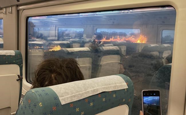 Help! Spaniards spooked when their train stops in wildfire | iNFOnews.ca