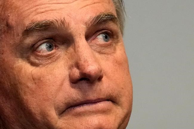 Brazil's Bolsonaro grabs at heckler, tries to take phone | iNFOnews.ca
