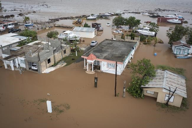 Fiona dumps more rain on Puerto Rico; troops rescue hundreds | iNFOnews.ca