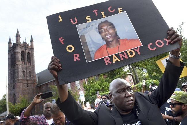 5 officers charged after Black man paralyzed in police van | iNFOnews.ca