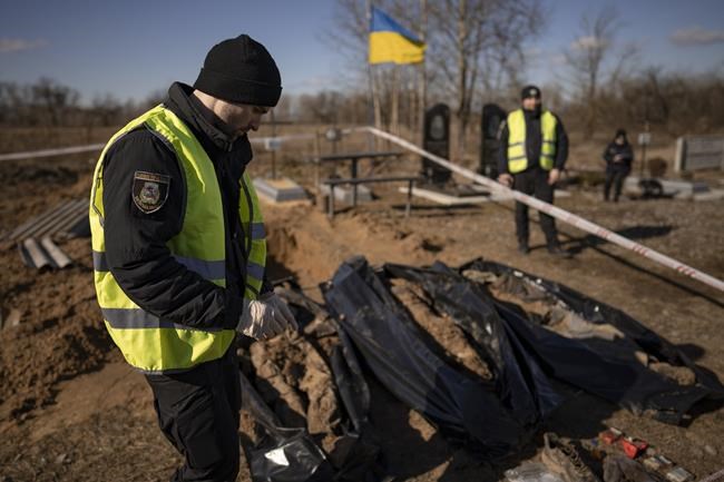 A year into Ukraine war, bodies dug up in once occupied town | iNFOnews.ca A year into Ukraine war, bodies dug up in once occupied town | iNFOnews.ca