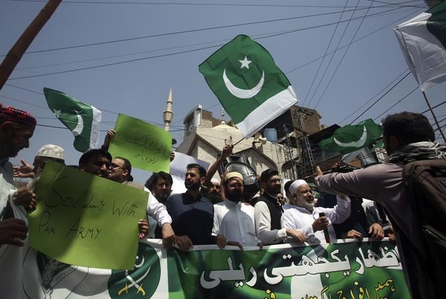Pakistan's Imran Khan dials down campaign of defiance, allows police search of home for suspects | iNFOnews.ca
