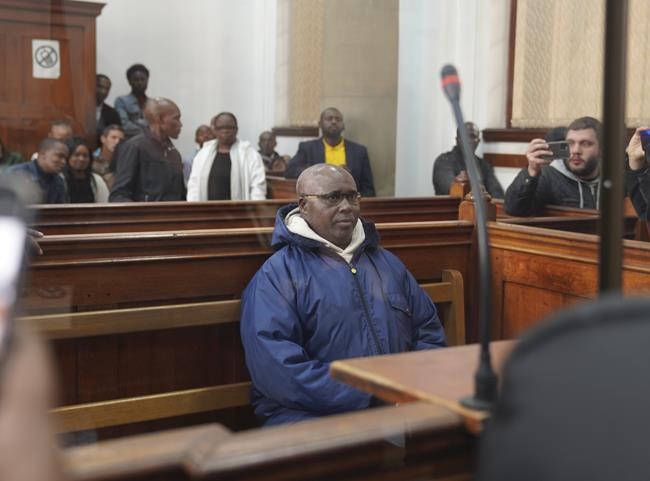 Rwandan genocide suspect appears in court holding Bible after 22 years on the run | iNFOnews.ca CP1146500815