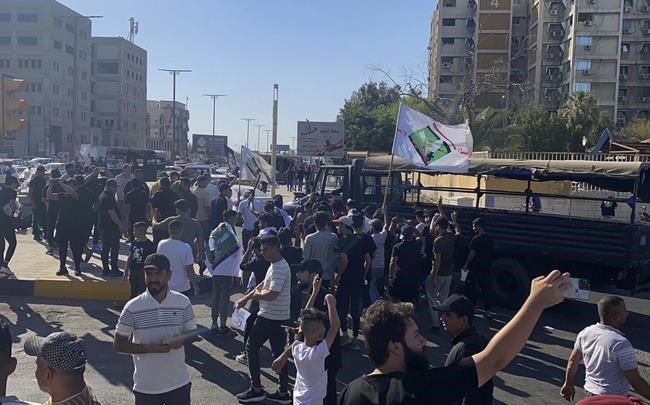 Protesters briefly storm the Swedish Embassy in Baghdad in protest over Quran burning | iNFOnews.ca