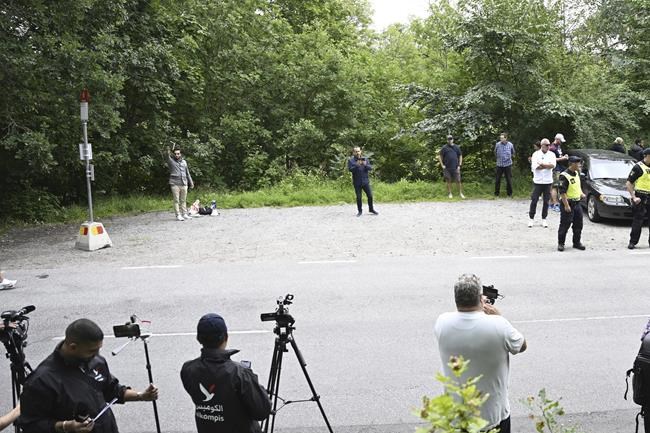 A woman interrupts a Quran-burning protest in Sweden by spraying activist with a fire extinguisher | iNFOnews.ca