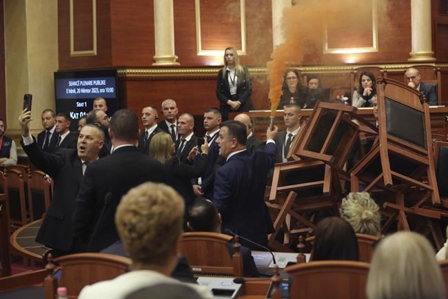 The Albanian opposition disrupts a Parliament vote on the budget with flares and piled-up chairs | iNFOnews.ca