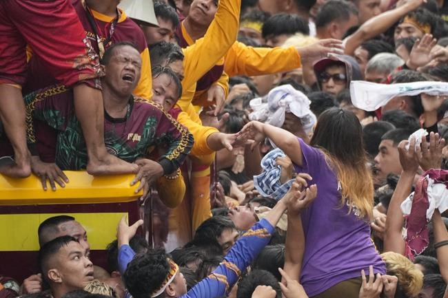 Filipino Catholics pray for Mideast peace in massive procession venerating a black statue of Jesus | iNFOnews.ca