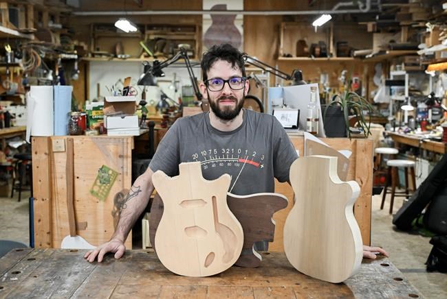 Montreal man turns reclaimed wood from barns and buildings into custom guitars | iNFOnews.ca
