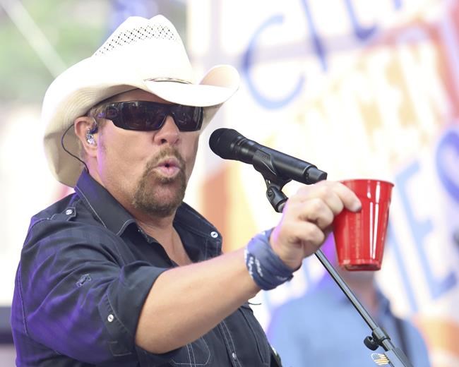 Fans raise a red Solo cup to honor Toby Keith, who immortalized the humble cup in song | iNFOnews.ca