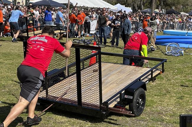 At the Florida Man Games, big crowds cheer competitors evading police, wrestling over beer | iNFOnews.ca