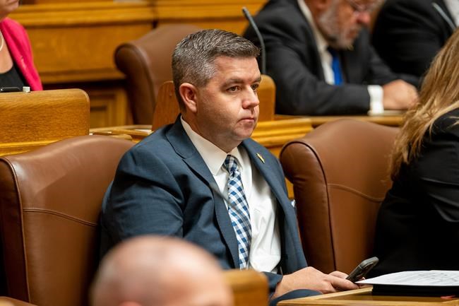Cabinet minister in camouflage with gun nearly caused security alert at legislature | iNFOnews.ca
