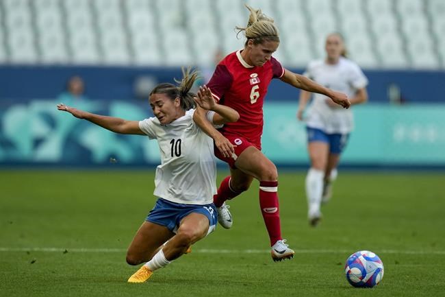 Defending champion Canada tops New Zealand 2-1 in Olympic soccer opener | iNFOnews.ca Defending champion Canada tops New Zealand 2-1 in Olympic soccer opener | iNFOnews.ca