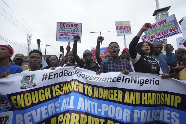 Police fire gunshots and tear gas as thousands protest Nigeria's crisis. Reports say 2 were killed | iNFOnews.ca
