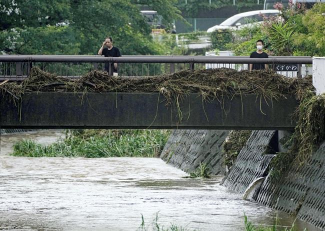 Slow tropical storm dumps heavy rain around Tokyo after causing floods in southern Japan | iNFOnews.ca
