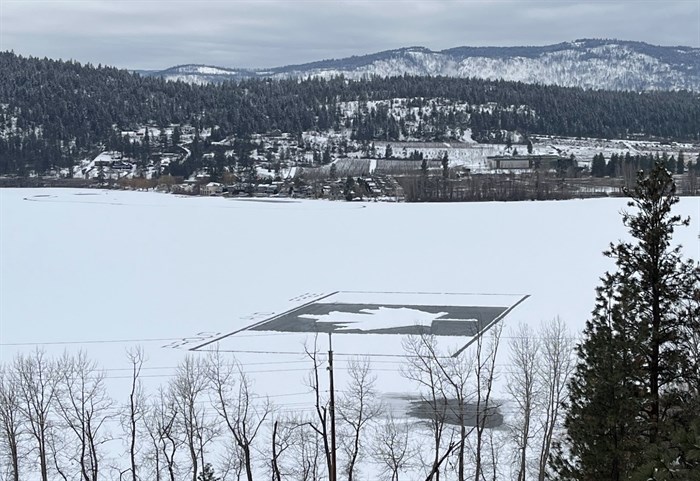 A Canadian flag etched in snow on a frozen lake in Kelowna.