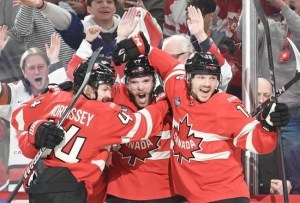 Hockey players celebrating in Canada jerseys.