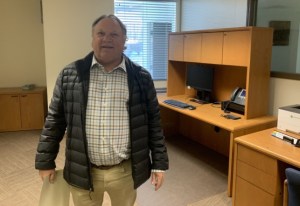 A man stands in an office.